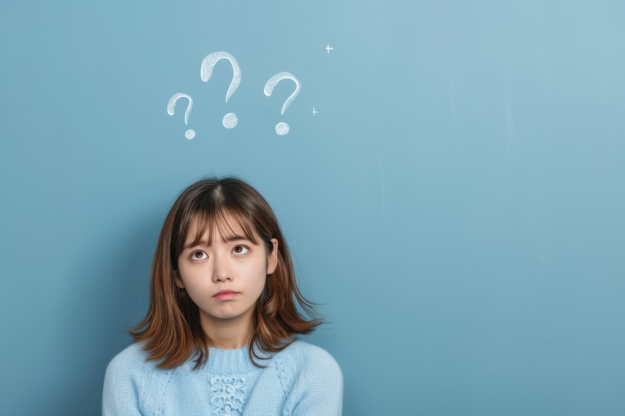 インプラントは虫歯になるのか考える女性